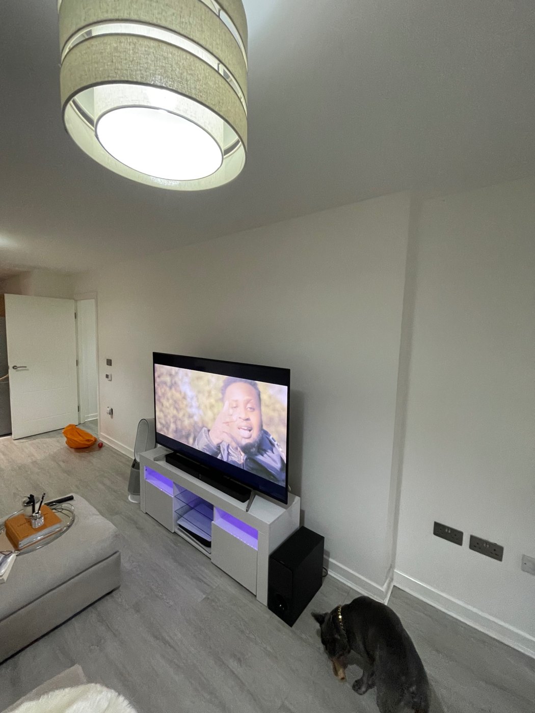 Before: Television on a freestanding unit before the media wall installation.